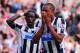 NEWCASTLE UPON TYNE, ENGLAND - SEPTEMBER 21: Moussa Sissoko (L) and Loic Remy (R) of Newcastle United react during the Barclays Premier League match between Newcastle United and Hull City at St James' Park on September 21, 2013 in Newcastle upon Tyne, En