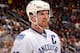 GLENDALE, AZ - JANUARY 16: Henrik Sedin #33 of the Vancouver Canucks looks across the ice during a stop in play against the Phoenix Coyotes at Jobing.com Arena on January 16, 2014 in Glendale, Arizona. (Photo by Norm Hall/NHLI via Getty Images)
