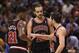 Feb 19, 2014; Toronto, Ontario, CAN; Chicago Bulls center Joakim Noah (13) listens to guard Kirk Hinrich (12) as forward Jimmy Butler (21) looks on against the Toronto Raptors at Air Canada Centre. The Bulls beat the Raptors 94-92. Mandatory Credit: Tom S