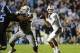 Oct 17, 2013; Chapel Hill, NC, USA; Miami Hurricanes quarterback Stephen Morris (17) looks to pass as offensive linesman Brandon Linder (65) and running back Dallas Crawford (25) block and North Carolina Tar Heels defensive end Kareem Martin (95) defends