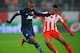 PIRAEUS, GREECE - FEBRUARY 25: (L-R) Ashley Young of Manchester United holds off Michael Olaitan of Olympiacos during the UEFA Champions League Round of 16 first leg match between Olympiacos FC and Manchester United at Karaiskakis Stadium on February 25,