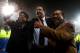 CARDIFF, WALES - JANUARY 24: Malky Mackay the Cardiff City manager celebrates with club owner Tan Sri Vincent Tan Chee Yioun (right) and chairman Chan Tien Ghee (left) following his team's 3-1 victory in the penalty shootout during the Carling Cup Semi F