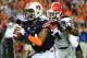 AUBURN, AL - NOVEMBER 16: Nick Marshall #14 of the Auburn Tigers is pursued by Ramik Wilson #51 of the Georgia Bulldogs at Jordan-Hare Stadium on November 16, 2013 in Auburn Alabama. (Photo by Scott Cunningham/Getty Images)