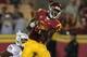 LOS ANGELES, CA - NOVEMBER 03: Wide receiver Marquise Lee #9 of the USC Trojans make a three yard touchdown catch over cornerback Ifo Ekpre-Olomu #14 of the Oregon Ducks with five seconds remaining in the game at the Los Angeles Memorial Coliseum on Nove