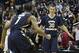 Dec 8, 2013; Washington, DC, USA; George Washington Colonials guard Maurice Creek (1) runs to George Washington Colonials forward Nemanja Mikic (30) after the game against Maryland Terrapins at Verizon Center. George Washington Colonials defeated Marylan