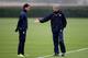 ST ALBANS, ENGLAND - NOVEMBER 22: Arsenal manager Arsene Wenger talks to Marouane Chamakh during Arsenal training ahead of their UEFA Champions League match against Braga at London Colney on November 22, 2010 in St Albans, England. (Photo by Scott Heave
