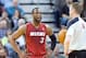 Feb 8, 2014; Salt Lake City, UT, USA; Miami Heat shooting guard Dwyane Wade (3) reacts to referee Ed Malloy (14) during the first half against the Utah Jazz at EnergySolutions Arena. Mandatory Credit: Russ Isabella-USA TODAY Sports