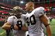 ATLANTA, GA - NOVEMBER 13: Drew Brees #9 and Jimmy Graham #80 of the New Orleans Saints celebrate after their 26-23 win in overtime against the Atlanta Falcons at Georgia Dome on November 13, 2011 in Atlanta, Georgia. (Photo by Kevin C. Cox/Getty Images