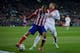 MADRID, SPAIN - FEBRUARY 11: Joao Miranda (L) of Atletico de Madrid holds Jese Rodriguez (R) of Real Madrid CF during the Copa del Rey semi-final second leg match between Club Atletico de Madrid and Real Madrid CF at Vicente Calderon Stadium on February 1