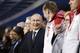 SOCHI, RUSSIA - FEBRUARY 23: Russian President Vladimir Putin, (4th L) stands next to Alexander Zubkov (3rd L), gold medalist in the two-man and four-man bobsled for Russia, during the 2014 Sochi Winter Olympics Closing Ceremony at Fisht Olympic Stadium