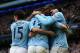 MANCHESTER, ENGLAND - FEBRUARY 22: Yaya Toure of Manchester City celebrates scoring the opening goal with his team-mates during the Barclays Premier League match between Manchester City and Stoke City at the Etihad Stadium on February 22, 2014 in Manches