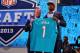 NEW YORK, NY - APRIL 25: Dion Jordan (R) of the Oregon Ducks stands with NFL Commissioner Roger Goodell as they hold up a jersey on stage after he was picked #3 overall by the Miami Dolphins in the first round of the 2013 NFL Draft at Radio City Music Ha