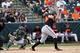 Feb 28, 2014; Phoenix, AZ, USA; San Francisco Giants first baseman Brandon Belt (9) hits a double in the second inning of their Spring Training baseball game with the Oakland Athletics at Phoenix Municipal Stadium. Mandatory Credit: Lance Iversen-USA TODA