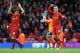 LIVERPOOL, ENGLAND - FEBRUARY 23: Jordan Henderson of Liverpool celebrates with Jon Flanagan at the end of the Barclays Premier League match between Liverpool and Swansea City at Anfield on February 23, 2014 in Liverpool, England. (Photo by Clive Brunsk