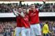LONDON, ENGLAND - FEBRUARY 22: Laurent Koscielny of Arsenal (C) celebrates with team-mates Olivier Giroud of Arsenal (L) and Per Mertesacker of Arsenal after scoring their third goal during the Barclays Premier League match between Arsenal and Sunderland