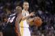 Feb 12, 2014; Oakland, CA, USA; Golden State Warriors guard Stephen Curry (30) is defended by Miami Heat guard Ray Allen (34) in the fourth quarter at Oracle Arena. The Heat defeated the Warriors 111-110. Mandatory Credit: Cary Edmondson-USA TODAY Sports