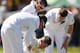 CAPE TOWN, SOUTH AFRICA - MARCH 01: Michael Clarke of Australia goes down after getting hit by a delivery from Morne Morkel of South Africa during day one of the third test match between South Africa and Australia at Newlands cricket ground on March 1, 2