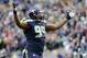 Nov 17, 2013; Seattle, WA, USA; Seattle Seahawks defensive tackle Tony McDaniel (99) celebrates after the Seattle Seahawks middle linebacker Bobby Wagner (54) (not pictured) intercepted the ball against the Minnesota Vikings during the second half at Cent