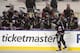 CHICAGO, IL - MARCH 1: (EDITORIAL USE ONLY) Patrick Sharp #10 of the Chicago Blackhawks celebrates his first period goal with the bench against the Pittsburgh Penguins during the 2014 NHL Stadium Series game on March 1, 2014 at Soldier Field in Chicago, I