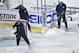 CHICAGO, IL - MARCH 1: (EDITORIAL USE ONLY) Crews clear snow from the ice during the first period of the 2014 Coors Light NHL Stadium Series game between the Chicago Blackhawks and the Pittsburgh Penguins at Soldier Field on March 1, 2014 in Chicago, Ill