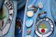 LONDON, ENGLAND - OCTOBER 27: A Man City supporter shows off his pin badges ahead of the Barclays Premier League match between Chelsea and Manchester City at Stamford Bridge on October 27, 2013 in London, England. (Photo by Clive Rose/Getty Images)