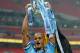 LONDON, ENGLAND - MARCH 02: Vincent Kompany of Manchester City celebrates with the trophy after the Capital One Cup Final between Manchester City and Sunderland at Wembley Stadium on March 2, 2014 in London, England. (Photo by Michael Regan/Getty Images)