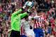 MADRID, SPAIN - MARCH 02: goalkeeper Diego Lopez of Real Madrid CF stops the ball agains his teammate Sergio Ramos (2ndR) and Diego Costa (R) of Atletico de Madrid during the La Liga match between Club Atletico de Madrid and Real Madrid CF at Vicente Cald