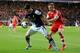 SOUTHAMPTON, ENGLAND - MARCH 01: Luke Shaw of Southampton challenges Luis Suarez of Liverpool during the Barclays Premier League match between Southampton and Liverpool at St Mary's Stadium on March 1, 2014 in Southampton, England. (Photo by David Canno