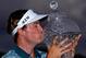 PALM BEACH GARDENS, FL - MARCH 02: Russell Henley celebrates with the trophy after winning The Honda Classic at PGA National Resort and Spa on March 2, 2014 in Palm Beach Gardens, Florida. (Photo by Stuart Franklin/Getty Images)