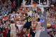 COLUMBUS, OH - FEBRUARY 11: Amir Williams #23 of the Ohio State Buckeyes defends as Caris LeVert #23 of the Michigan Wolverines attempts to drive to the basket in the second half on February 11, 2014 at Value City Arena in Columbus, Ohio. Michigan defeat