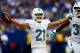 Sep 15, 2013; Indianapolis, IN, USA; Miami Dolphins cornerback Brent Grimes (21) celebrates with teammate after intercepting a pass during the third quarter against the Indianapolis Colts at Lucas Oil Stadium. Mandatory Credit: Andrew Weber-USA TODAY Spor