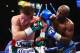 LAS VEGAS, NV - SEPTEMBER 14: (L-R) Floyd Mayweather Jr. throws a right to Canelo Alvarez during their WBC/WBA 154-pound title fight at the MGM Grand Garden Arena on September 14, 2013 in Las Vegas, Nevada. (Photo by Al Bello/Getty Images)