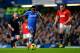 LONDON, ENGLAND - JANUARY 19: Samuel Eto'o of Chelsea takes on Phil Jones of manchester United prior to scoring the opening goal during the Barclays Premier League match between Chelsea and Manchester United at Stamford Bridge on January 19, 2014 in Lond