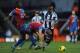 LONDON, ENGLAND - FEBRUARY 08: Saido Berahino (R) of West Bromwich Albion evades the Crystal Palace defence during the Barclays Premier League match between Crystal Palace and West Bromwich Albion at Selhurst Park on February 8, 2014 in London, England.