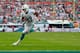 MIAMI GARDENS, FL - DECEMBER 15: Daniel Thomas #33 of the Miami Dolphins scores a touchdown in the fourth quarter against the New England Patriots looks on at Sun Life Stadium on December 15, 2013 in Miami Gardens, Florida. (Photo by Chris Trotman/Getty