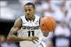 Mar 1, 2014; East Lansing, MI, USA; Michigan State Spartans guard Keith Appling (11) brings the ball up court against the Illinois Fighting Illini during the 2nd half of a game at Jack Breslin Student Events Center. Illinois won 53-46. Mandatory Credit: M