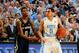 Mar 3, 2014; Chapel Hill, NC, USA; North Carolina Tar Heels guard Marcus Paige (5) is fouled by Notre Dame Fighting Irish guard Eric Atkins (0) in the last minute of the game. The Tar Heels defeated the Fighting Irish 63-61 at Dean E. Smith Student Activi