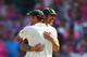 SYDNEY, AUSTRALIA - JANUARY 05: Ryan Harris and Mitchell Johnson of Australia embrace after winning the Ashes series 5-0 during day three of the Fifth Ashes Test match between Australia and England at Sydney Cricket Ground on January 5, 2014 in Sydney, Au