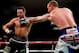MANCHESTER, ENGLAND - NOVEMBER 23: Carl Froch (L) in action with George Groves during their IBF and WBA World Super Middleweight bout at Phones4u Arena on November 23, 2013 in Manchester, England. (Photo by Scott Heavey/Getty Images)