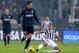 TURIN, ITALY - FEBRUARY 02: Arturo Vidal of Juventus #23 and Ricardo Alvarez of FC Inter Milan compete for the ball during the Serie A match between Juventus and FC Internazionale Milano at Juventus Arena on February 2, 2014 in Turin, Italy. (Photo by C