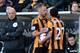 HULL, ENGLAND - MARCH 01: David Meyler of Hull City clashes with Alan Pardew, Manager of Newcastle United during the Barclays Premier League match between Hull City and Newcastle United at KC Stadium on March 1, 2014 in Hull, England. (Photo by Tony Mar