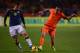 AMSTERDAM, NETHERLANDS - NOVEMBER 19: James Rodriguez of Colombia is challenged by Gregory van der Wiel of Netherlands during the International Friendly match between Netherlands and Colombia at Amsterdam ArenA on November 19, 2013 in Amsterdam, Netherla