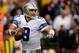 LANDOVER, MD - DECEMBER 22: Quarterback Tony Romo #9 of the Dallas Cowboys scrambles with the ball in the second half during an NFL game against the Washington Redskins at FedExField on December 22, 2013 in Landover, Maryland. (Photo by Patrick McDermot