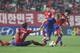JEONJU, SOUTH KOREA - SEPTEMBER 10: Alen Halilovic of Croatia competes for the ball with Kim Young-Gwon and Han Kook-Young of South Korea during the international friendly match between South Korea and Croatia at the Jeonju World Cup Stadium on September