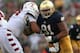 SOUTH BEND, IN - AUGUST 31: Sheldon Day #91 of the Notre Dame Fighting Irish rushes against Zach Hooks #54 of the Temple Owls at Notre Dame Stadium on August 31, 2013 in South Bend, Indiana. Notre Dame defeated Temple 28-6. (Photo by Jonathan Daniel/Get