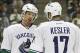 Oct 19, 2013; Pittsburgh, PA, USA; Vancouver Canucks center Henrik Sedin (33) and center Ryan Kesler (17) talk on the ice against the Pittsburgh Penguins during the first period at the CONSOL Energy Center. The Pens won 4-3 in a shootout. Mandatory Credit