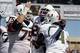 Sep 28, 2013; Tampa, FL, USA; Miami Hurricanes running back Dallas Crawford (25) is congratulated by teammates after he ran the ball in for a touchdown during the first quarter against the South Florida Bulls at Raymond James Stadium. Mandatory Credit: Ki