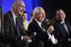 ESPN senior vice president Justin Connolly (right) with SEC Commissioner Mike Slive (center) and ESPN President John Skipper.