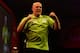 LONDON, ENGLAND - JANUARY 01: Michael van Gerwen celebrates defeating Peter Wright of Scotland and winning the final of the Ladbrokes.com World Darts Championships at Alexandra Palace on January 1, 2014 in London, England. (Photo by Ben Hoskins/Getty Im