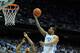CHAPEL HILL, NC - FEBRUARY 20: Leslie McDonald #2 of the North Carolina Tar Heels drives to the basket against Rodney Hood #5 of the Duke Blue Devils during their game at the Dean Smith Center on February 20, 2014 in Chapel Hill, North Carolina. North Ca